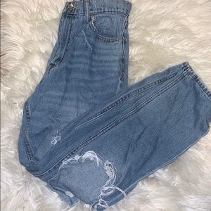 High waisted light washed ripped mom jeans